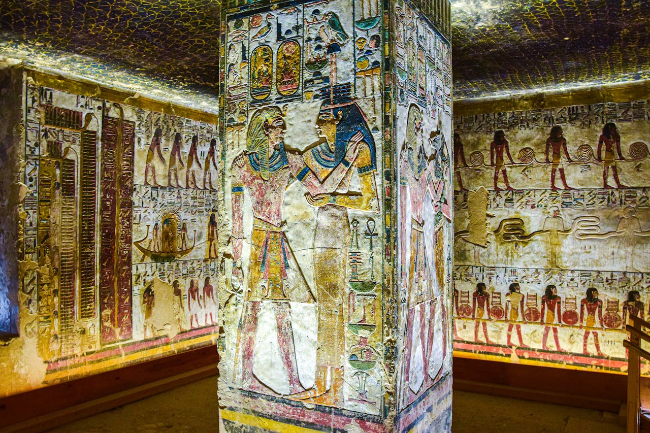 Detailed wall paintings in the Tomb of Seti I showcasing ancient Egyptian art.